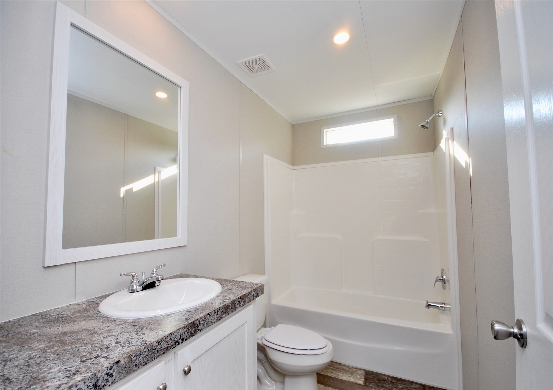1727 Davis Road West Point, TX 78963 - Photo 21 of 40 a bathroom with a granite countertop sink toilet and shower