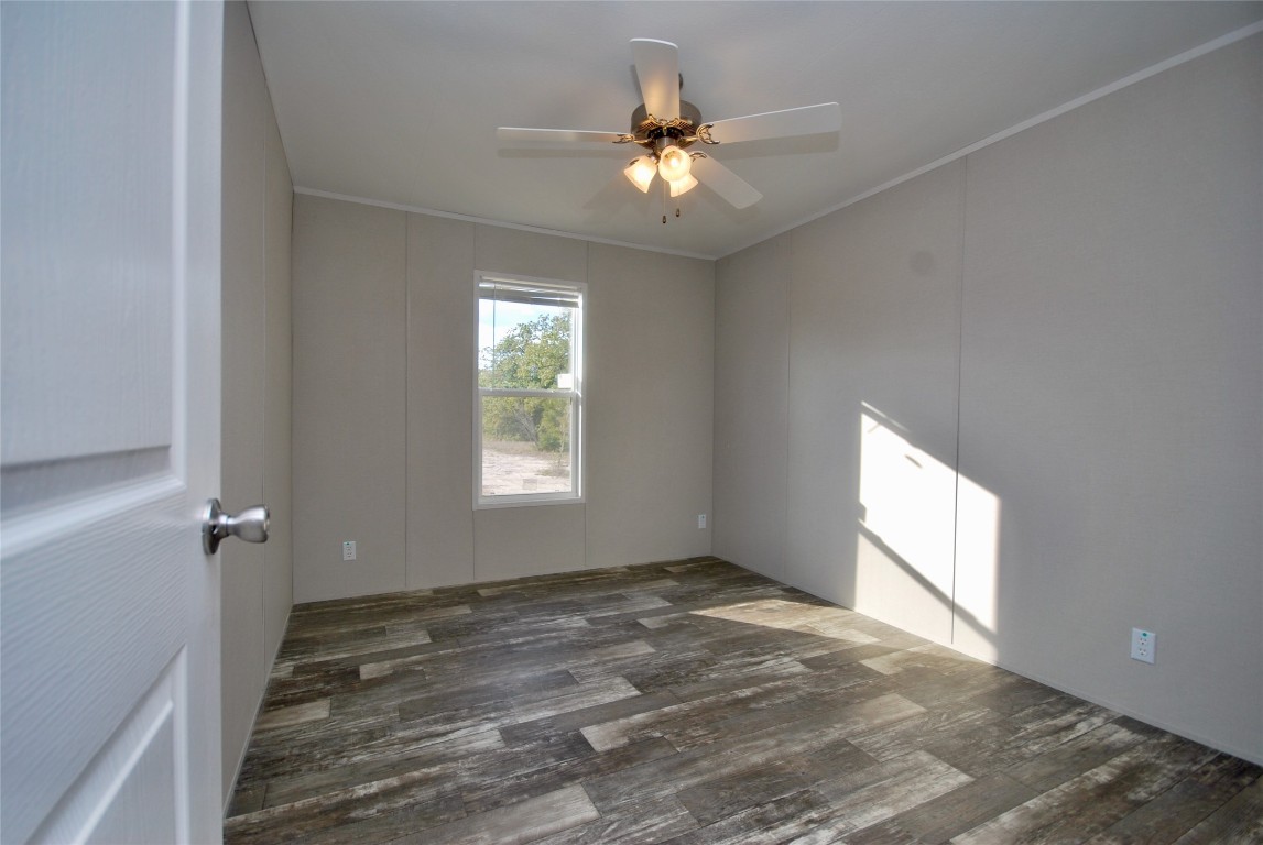1727 Davis Road West Point, TX 78963 - Photo 22 of 40 wooden floor in an empty room with a window