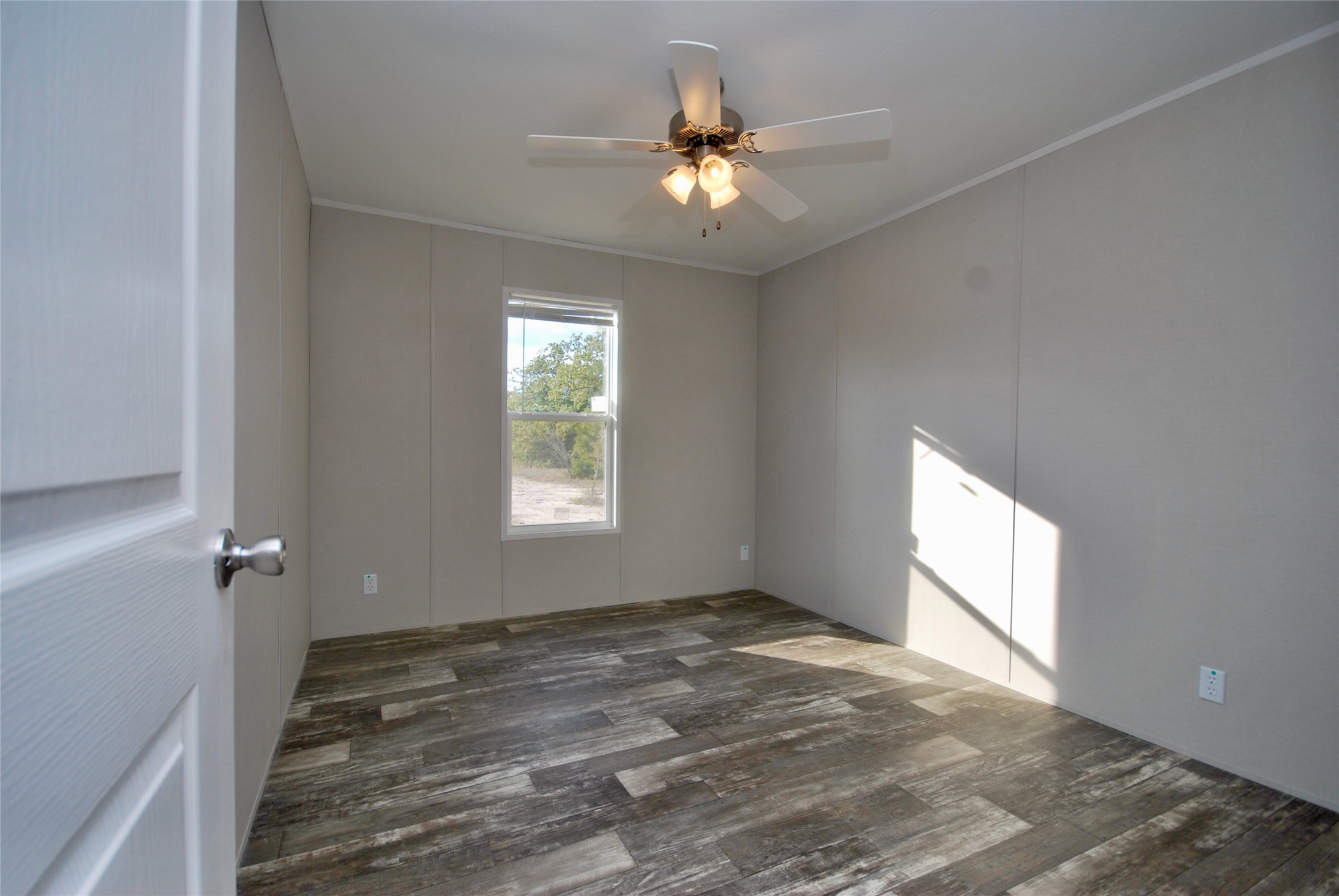 1727 Davis Road West Point, TX 78963 - Photo 22 of 40 wooden floor in an empty room with a window