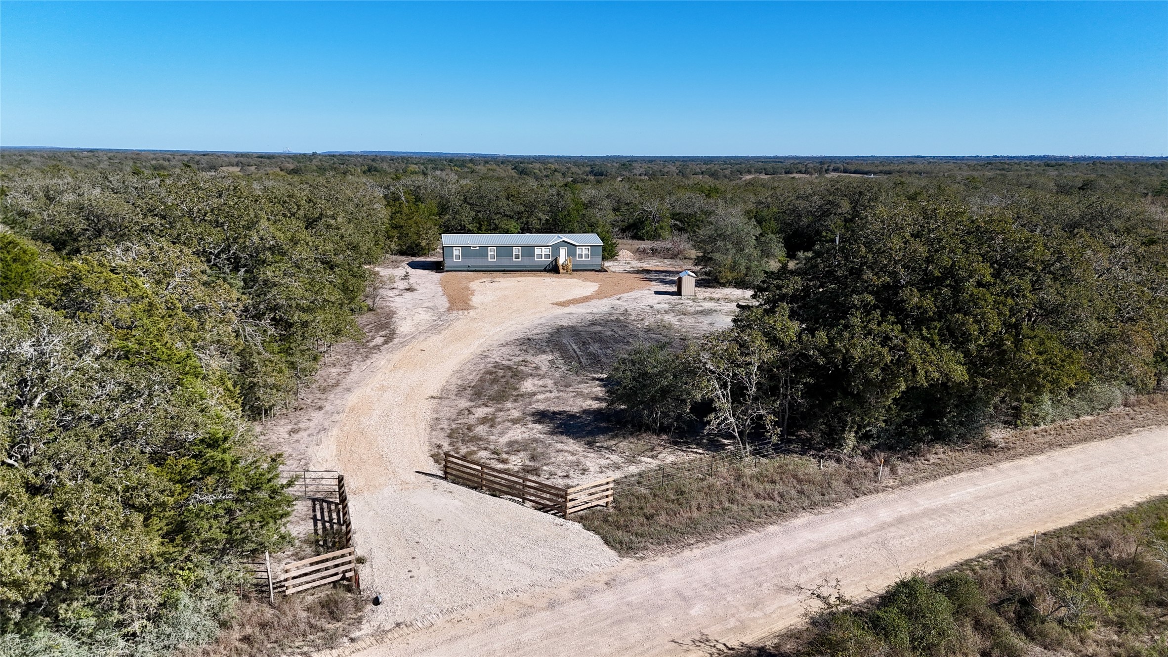 1727 Davis Road West Point, TX 78963 - Photo 3 of 40 a view of a dry yard with wooden fence