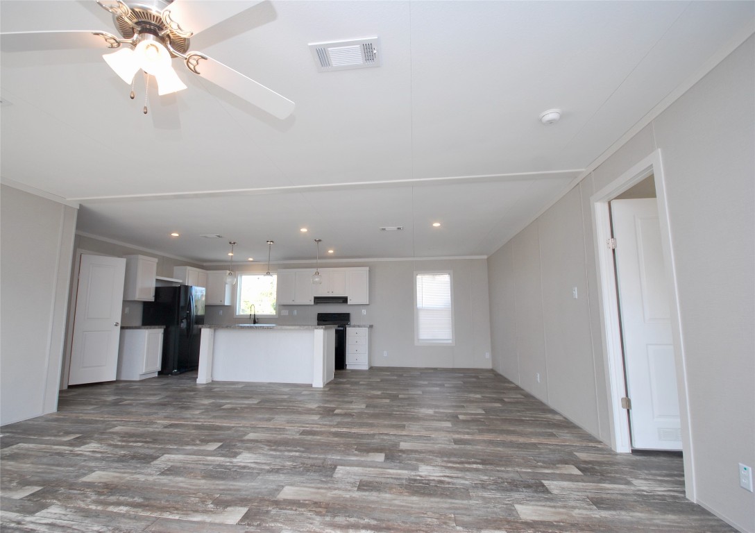 1727 Davis Road West Point, TX 78963 - Photo 5 of 40 a view of a kitchen with a sink and a refrigerator
