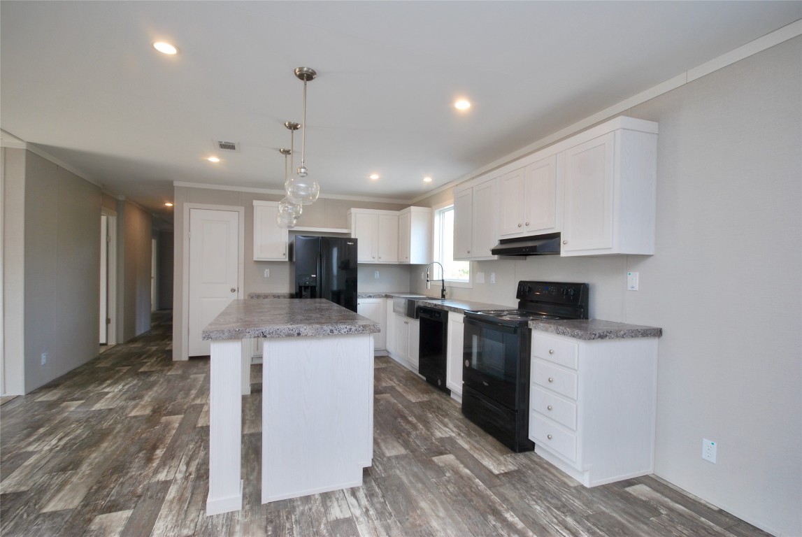 1727 Davis Road West Point, TX 78963 - Photo 7 of 40 a kitchen with a sink a counter top space stainless steel appliances and cabinets