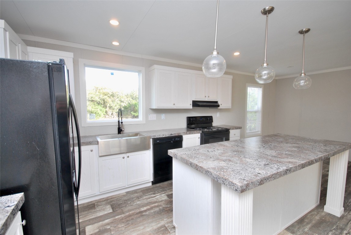1727 Davis Road West Point, TX 78963 - Photo 9 of 40 a kitchen with a refrigerator a sink and a stove