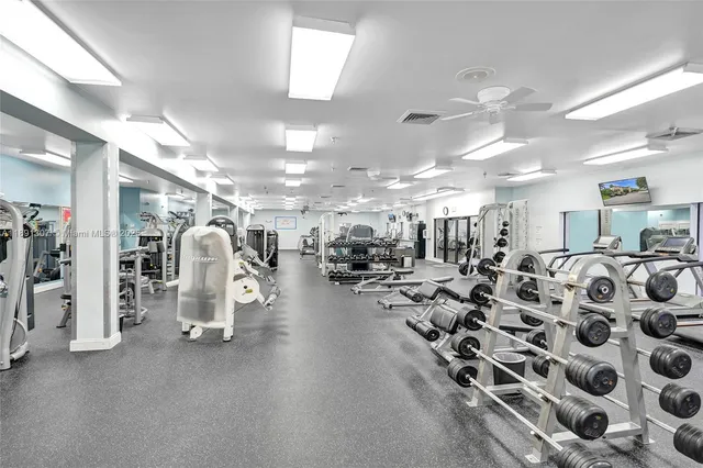 a living room with fireplace furniture and a floor to ceiling window