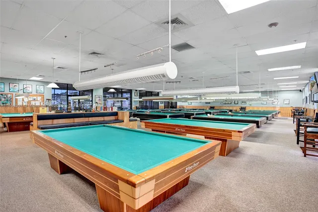 an aerial view of a swimming pool yard and outdoor seating
