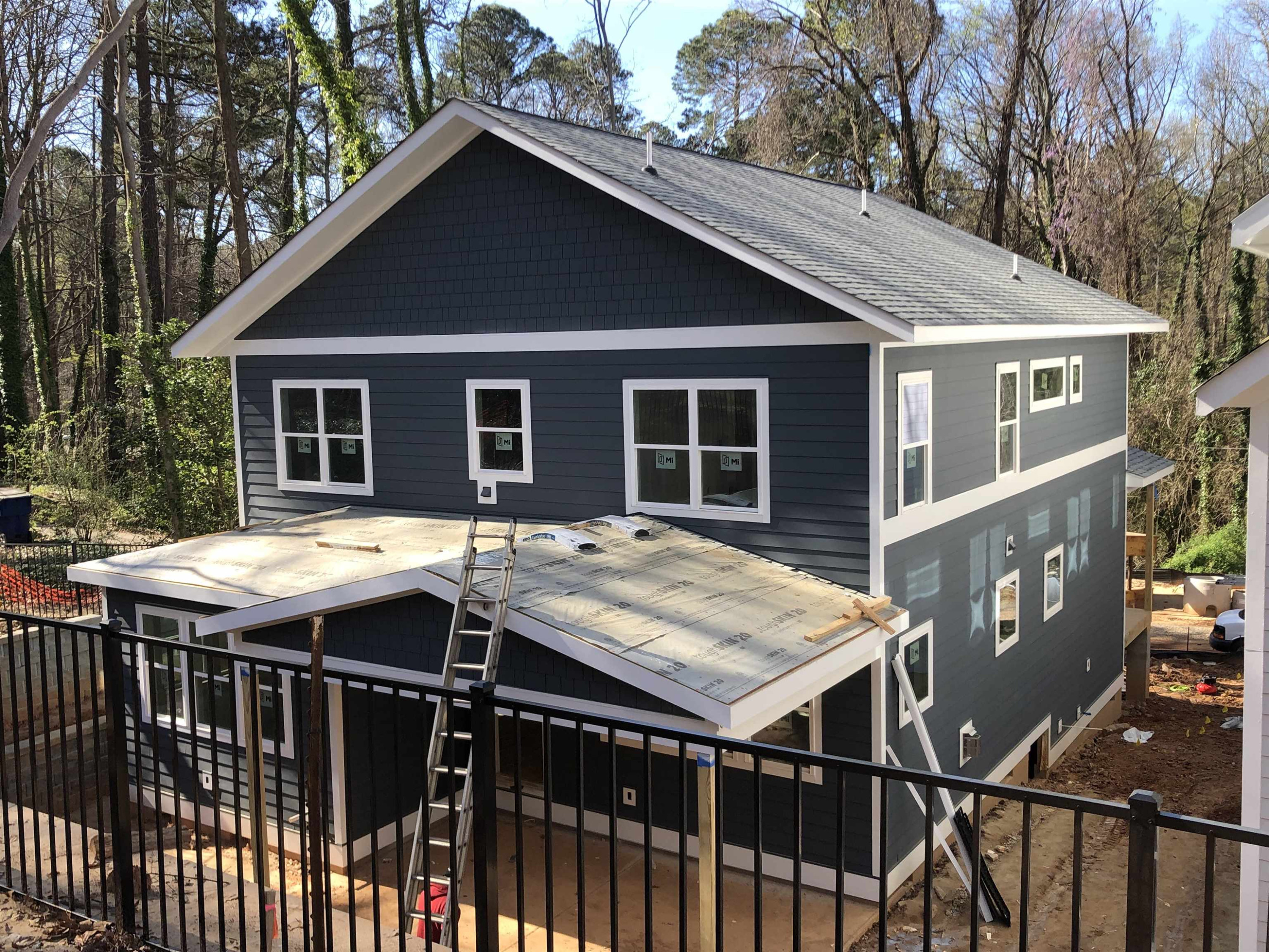 1415 Onslow Road Raleigh, NC 27606 - Photo 3 of 21 a roof deck with a table and chairs