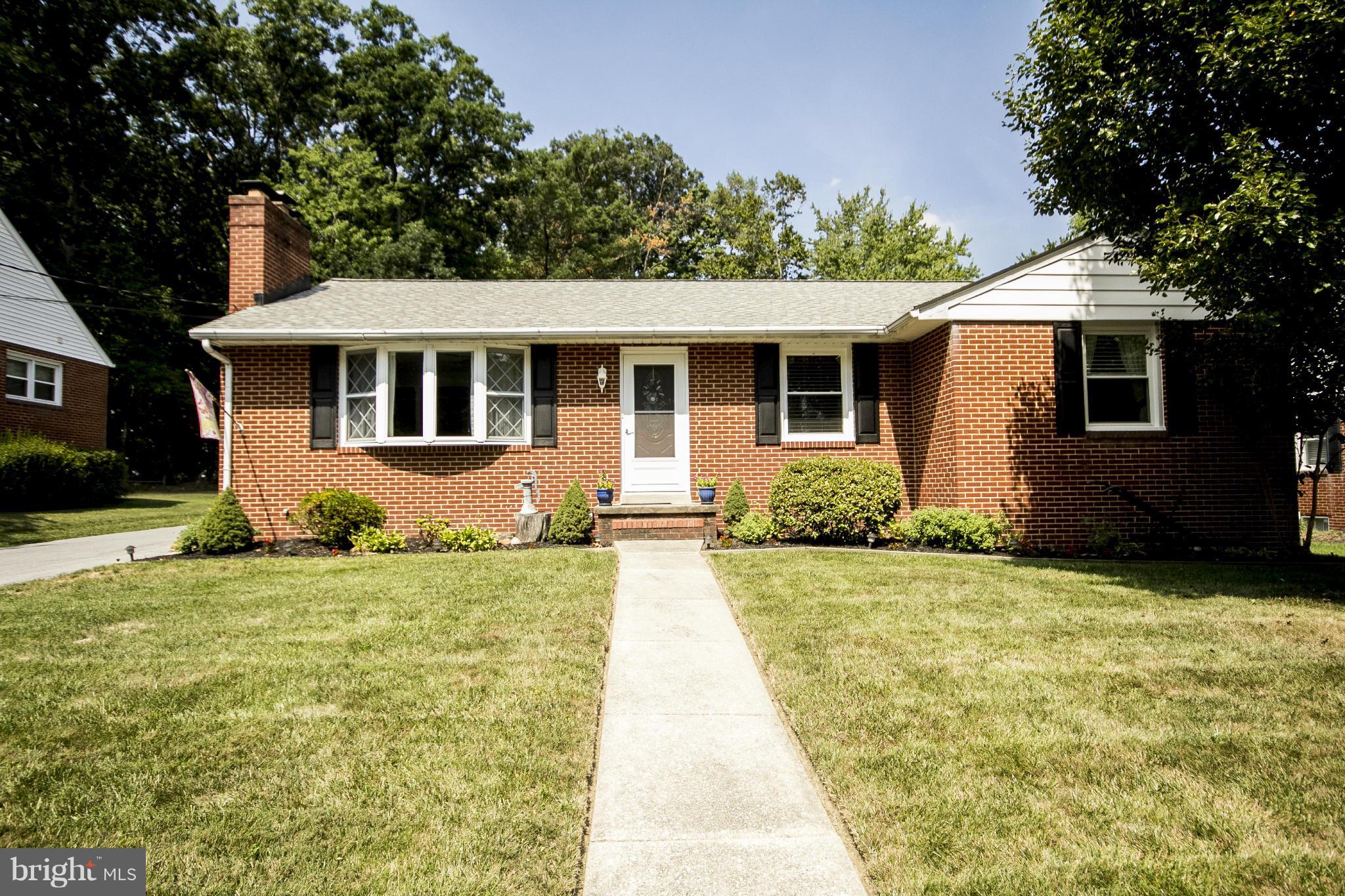 9810 Gunforge Road Perry Hall, MD 21128 - Photo 1 of 30 a front view of a house with a yard
