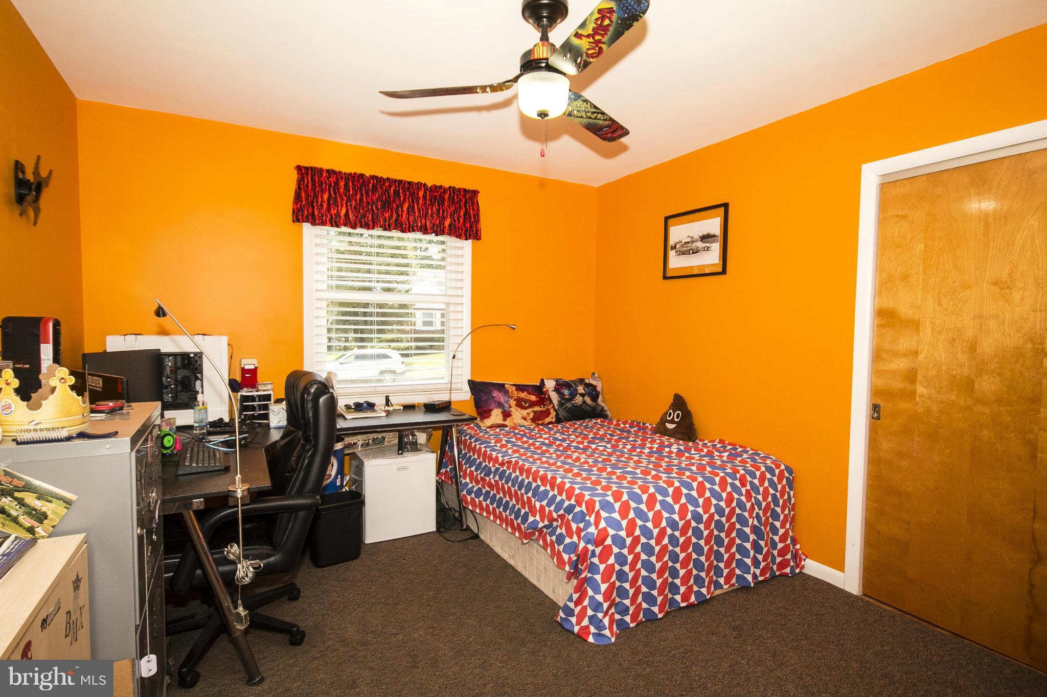 9810 Gunforge Road Perry Hall, MD 21128 - Photo 14 of 30 a bedroom with a bed and a chandelier