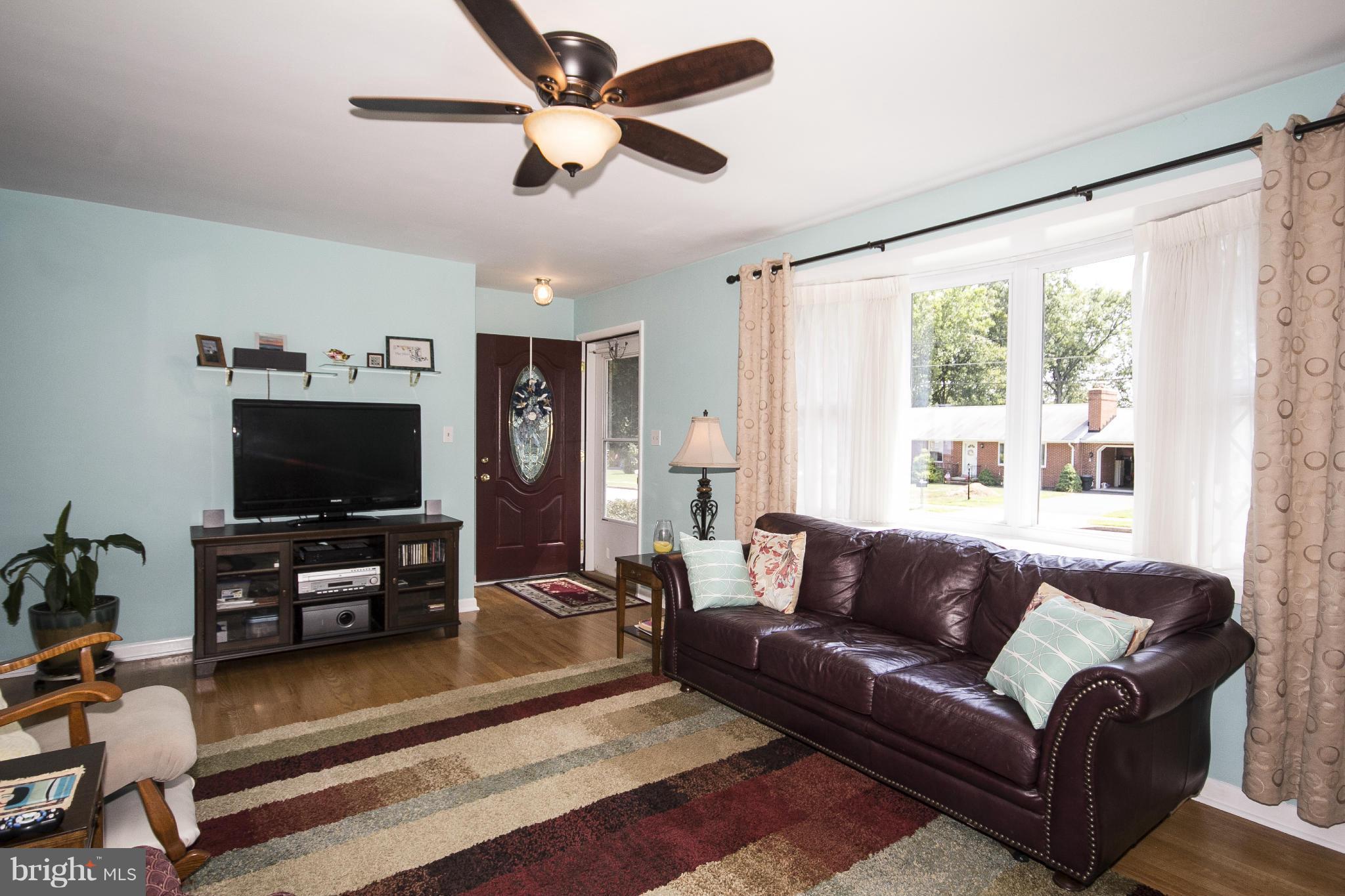 9810 Gunforge Road Perry Hall, MD 21128 - Photo 3 of 30 a living room with furniture and a flat screen tv