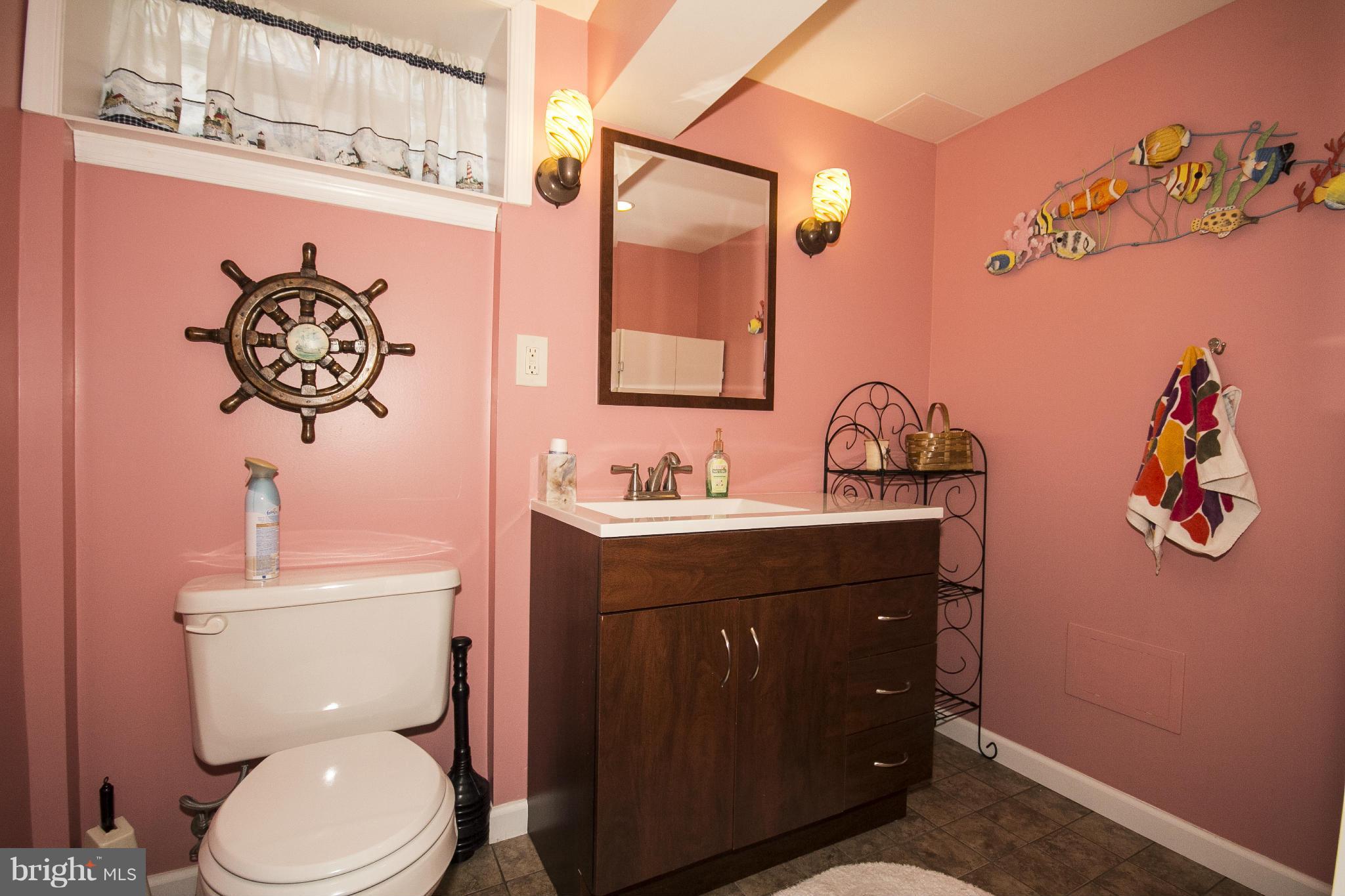 9810 Gunforge Road Perry Hall, MD 21128 - Photo 23 of 30 a bathroom with a toilet a sink and mirror