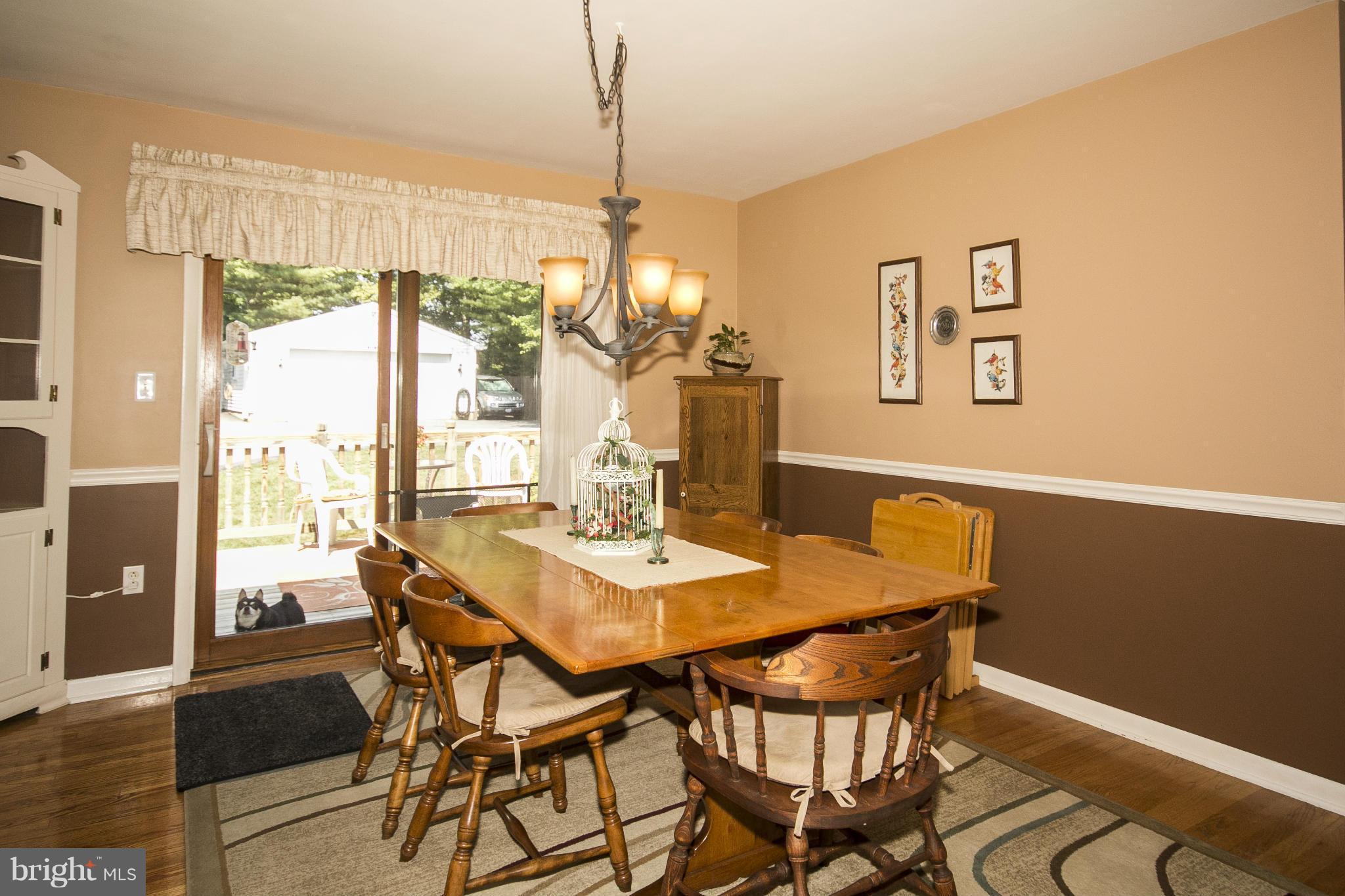 9810 Gunforge Road Perry Hall, MD 21128 - Photo 5 of 30 a view of a dining room with furniture window and wooden floor