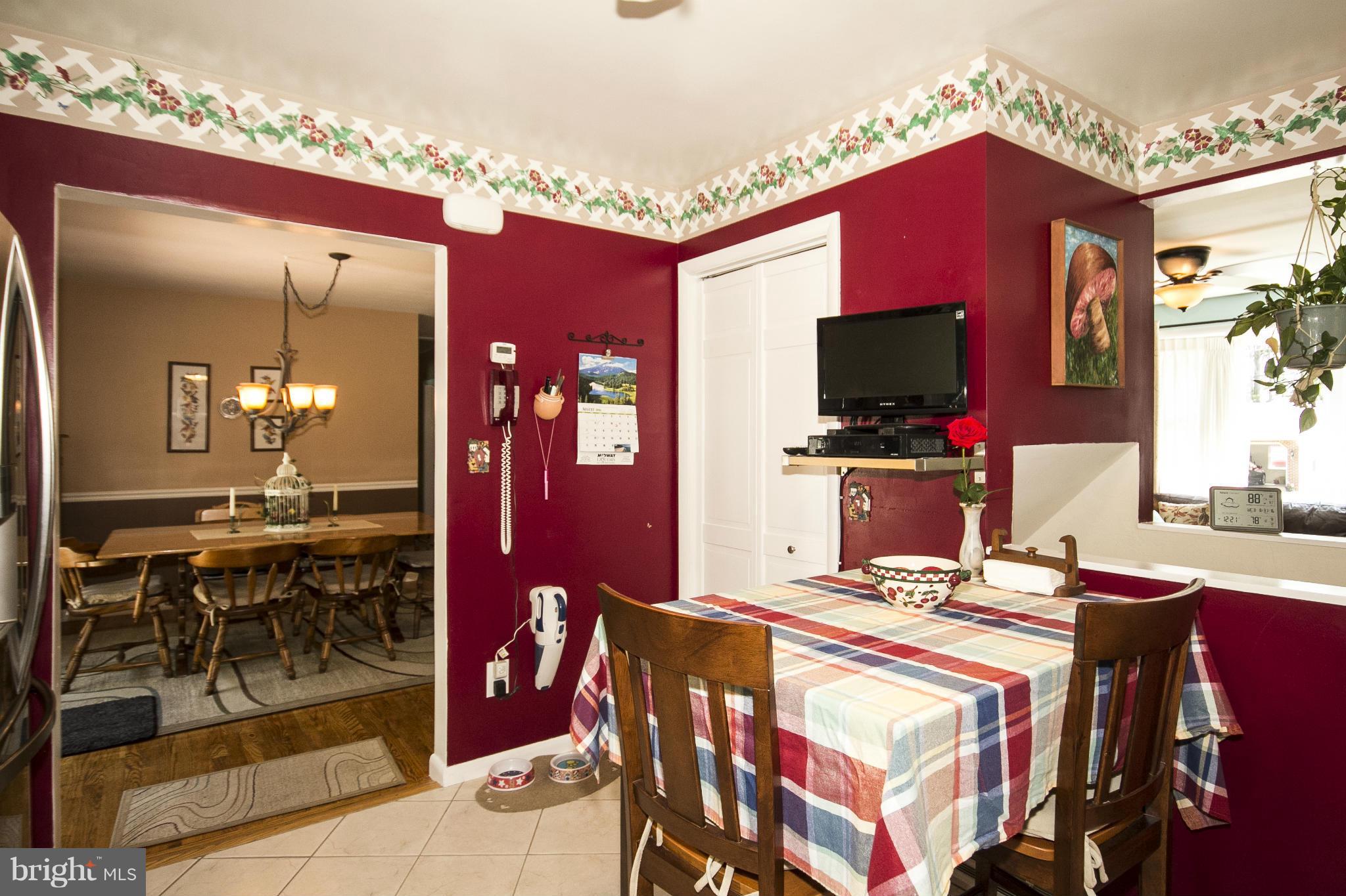 9810 Gunforge Road Perry Hall, MD 21128 - Photo 8 of 30 a dinning table and chairs in a open kitchen