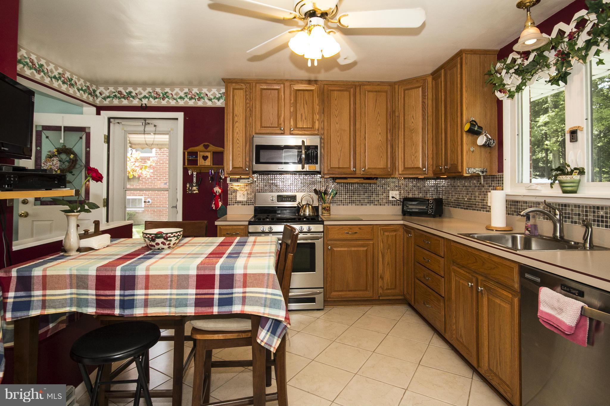 9810 Gunforge Road Perry Hall, MD 21128 - Photo 9 of 30 a kitchen with a sink appliances and cabinets