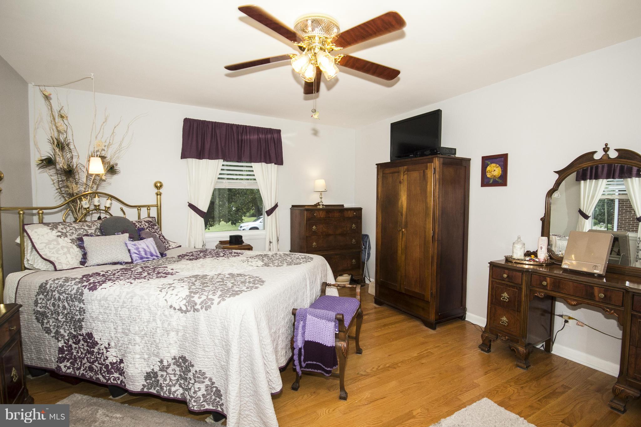 9810 Gunforge Road Perry Hall, MD 21128 - Photo 10 of 30 a bed room with a bed window and a chair