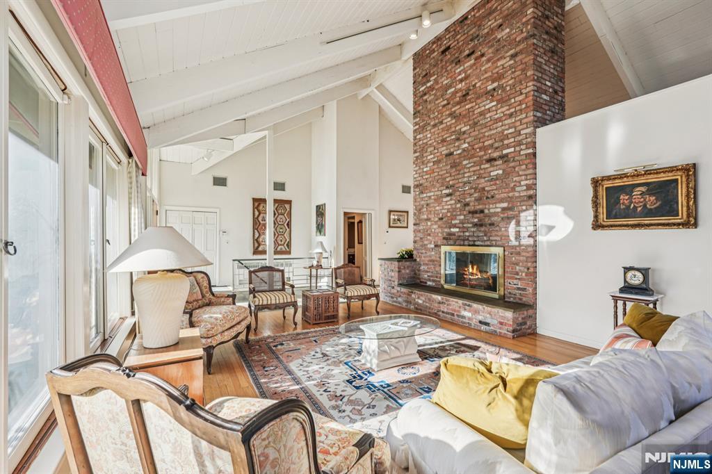 873 Olentangy Road Franklin Lakes, NJ 07417 - Photo 1 of 41 a living room with furniture a fireplace and a table
