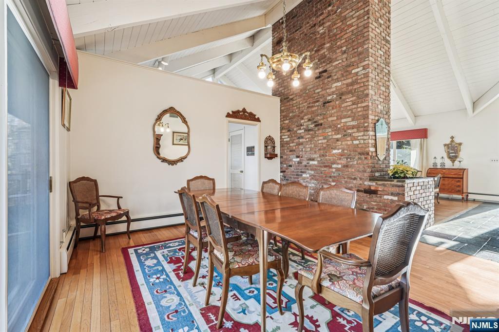 873 Olentangy Road Franklin Lakes, NJ 07417 - Photo 11 of 41 a dining room with furniture and wooden floor