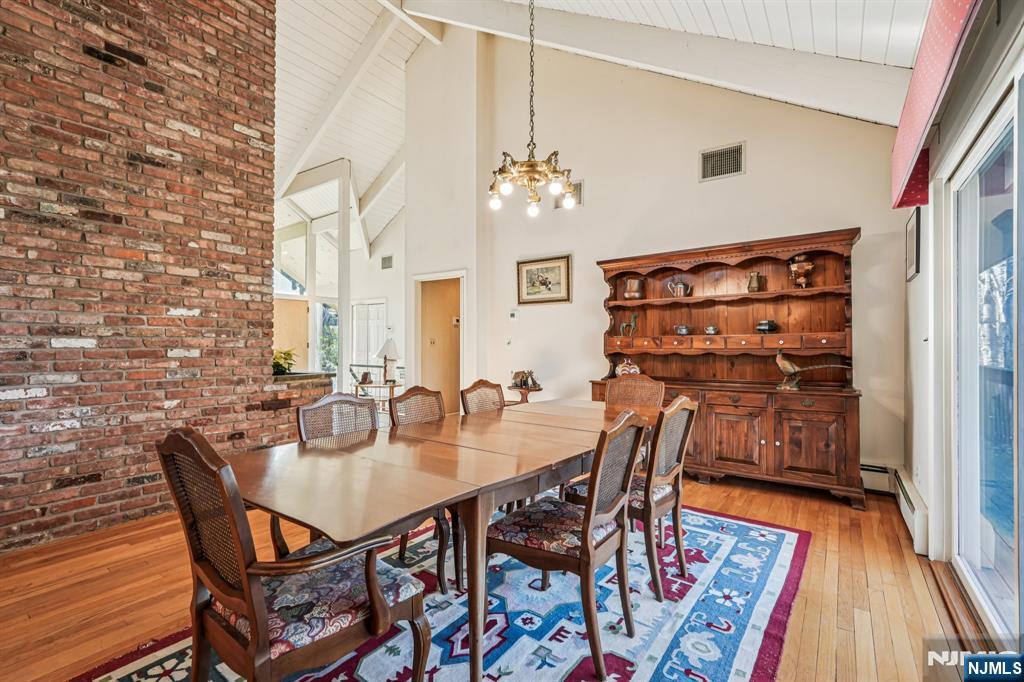 873 Olentangy Road Franklin Lakes, NJ 07417 - Photo 13 of 41 a dining room with furniture and wooden floor