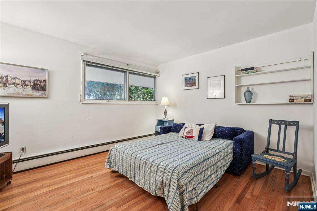 873 Olentangy Road Franklin Lakes, NJ 07417 - Photo 19 of 41 a bedroom with a bed and wooden floor
