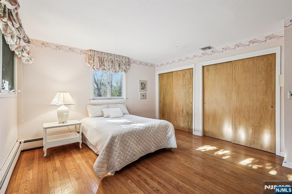 873 Olentangy Road Franklin Lakes, NJ 07417 - Photo 25 of 41 a bedroom with a bed and a window