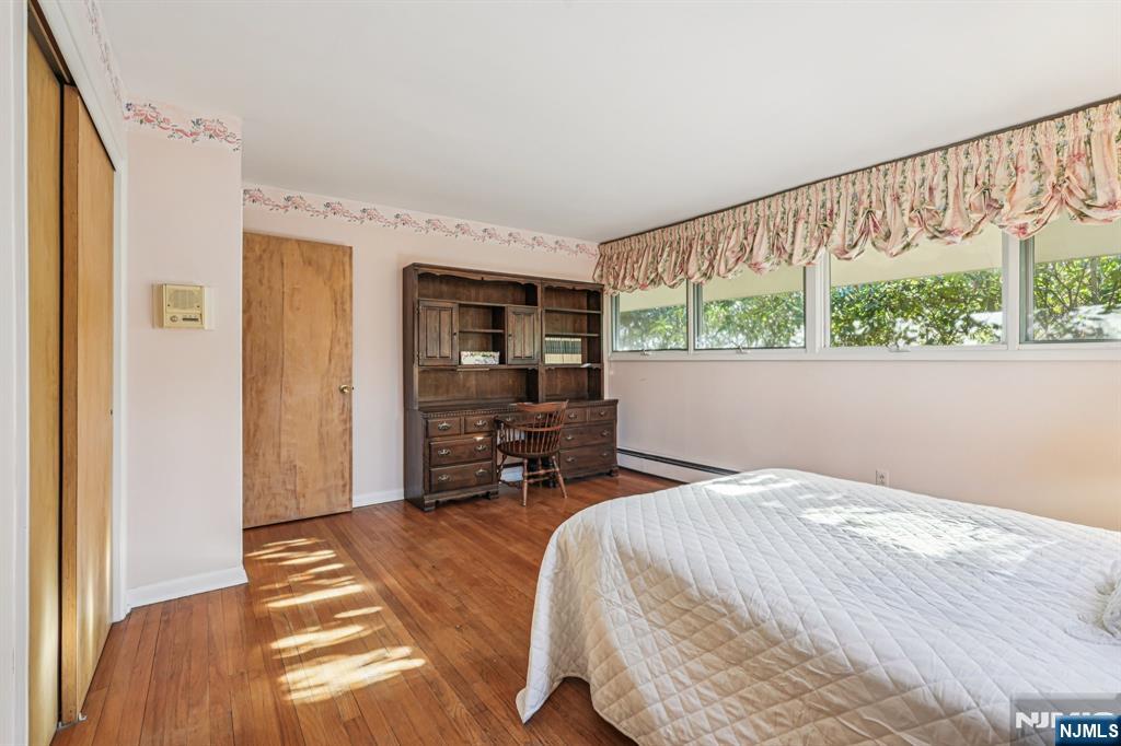 873 Olentangy Road Franklin Lakes, NJ 07417 - Photo 26 of 41 a bed sitting in a bedroom next to a window