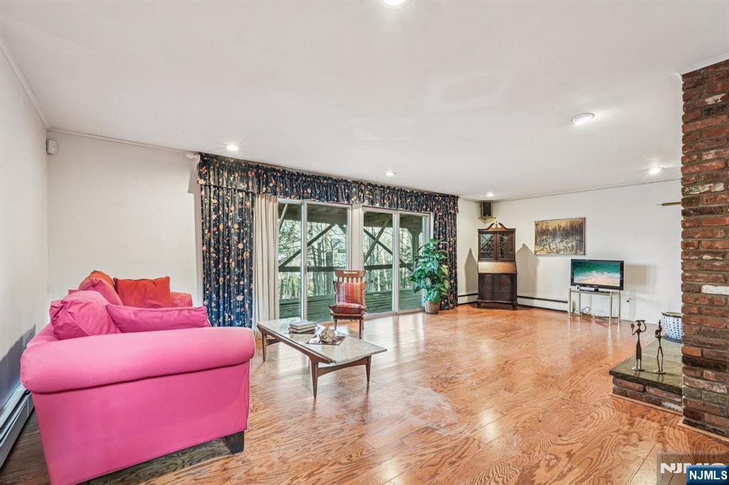 873 Olentangy Road Franklin Lakes, NJ 07417 - Photo 31 of 41 a living room with furniture and a fireplace