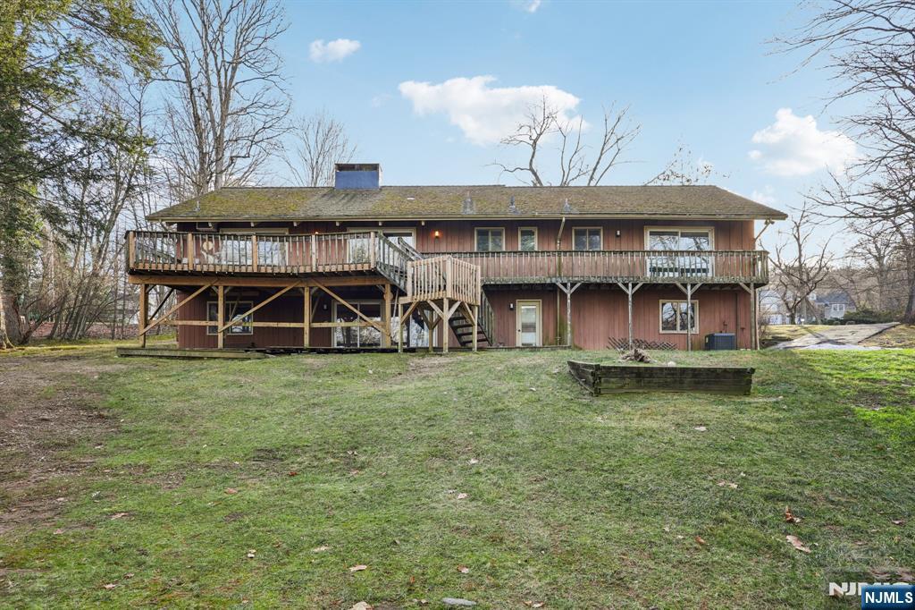 873 Olentangy Road Franklin Lakes, NJ 07417 - Photo 40 of 41 a view of a house with a yard