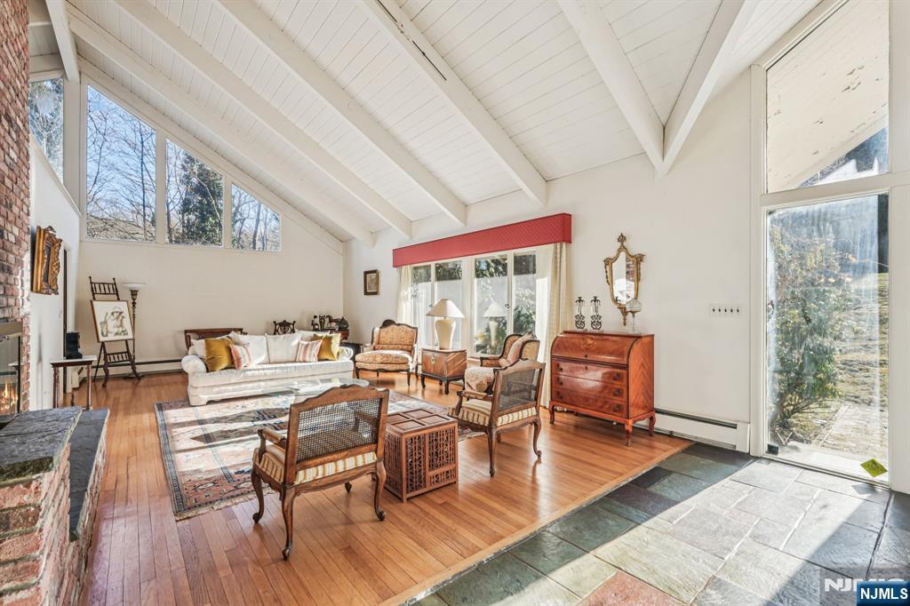 873 Olentangy Road Franklin Lakes, NJ 07417 - Photo 4 of 41 a living room with furniture a wooden floor and next to a large window