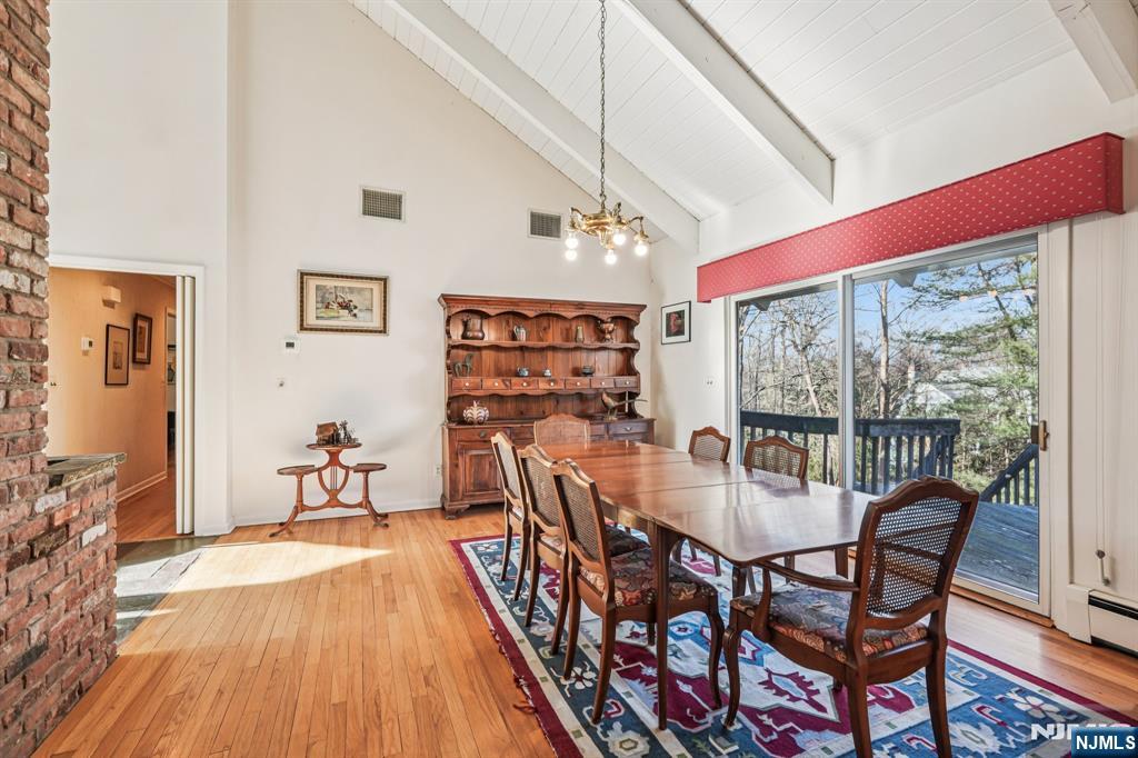 873 Olentangy Road Franklin Lakes, NJ 07417 - Photo 10 of 41 a view of a dining room with furniture window and wooden floor