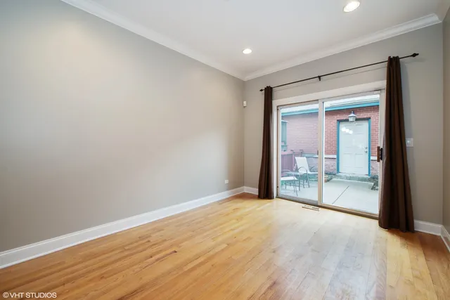 a view of a big room with wooden floor and balcony