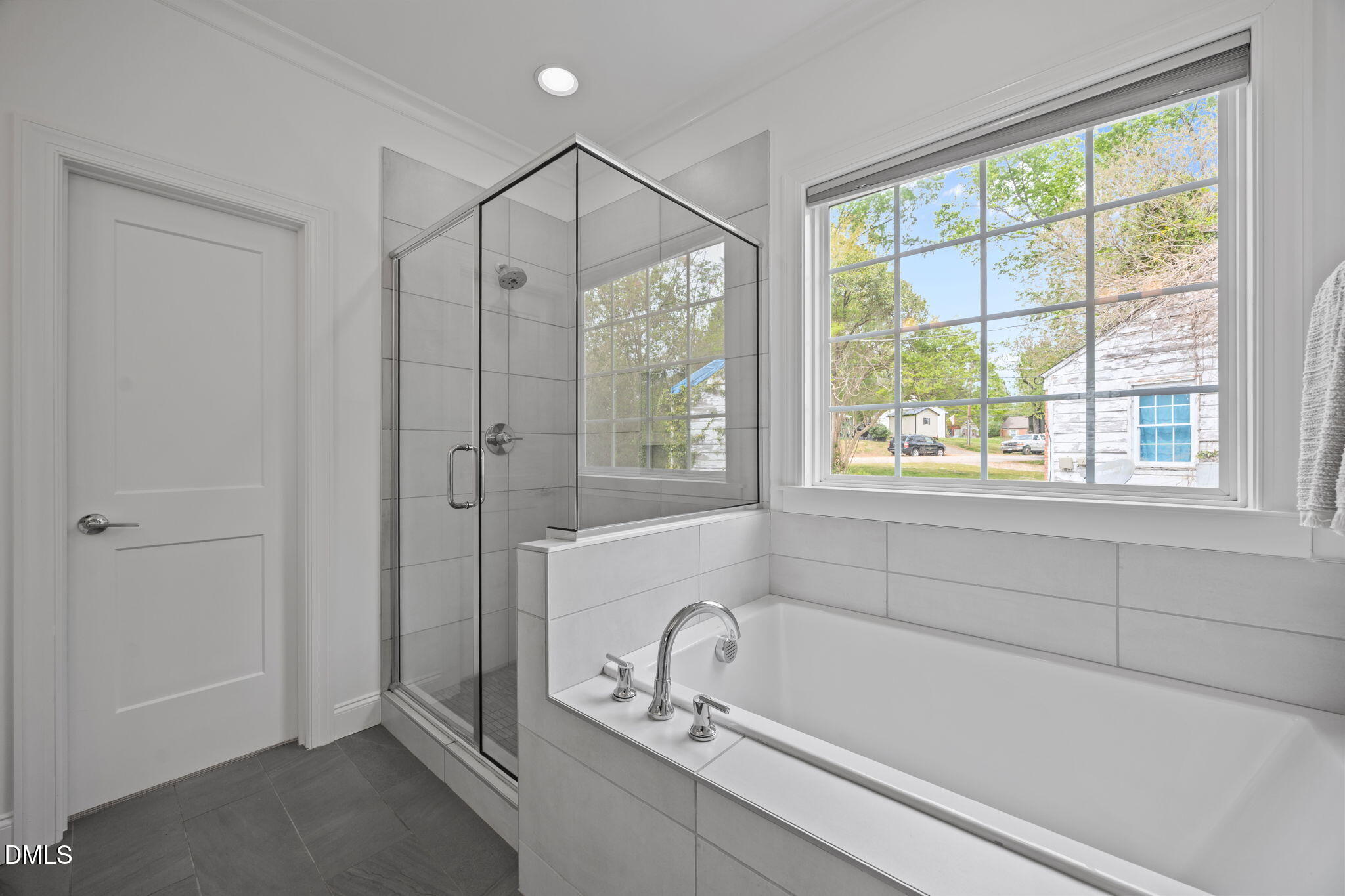 804 Hartford Road Raleigh, NC 27610 - Photo 12 of 26 a bathroom with a tub a sink and a window