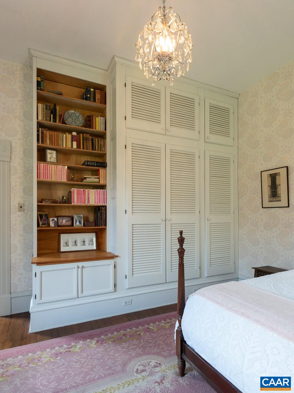 1521 Craigs Store Road Afton, VA 22920 - Photo 16 of 42 a bedroom with a bed and a chandelier