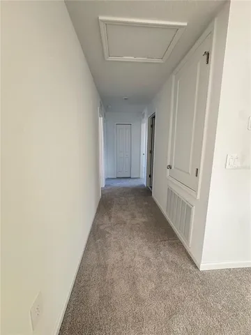 a view of hallway with white walls