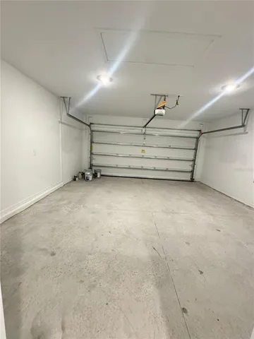 a view of room with stairs and a projector