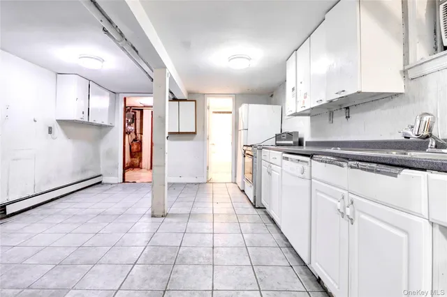 a kitchen with stainless steel appliances granite countertop a refrigerator and a stove