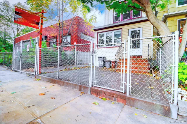 a view of a kitchen with wooden floor and windows