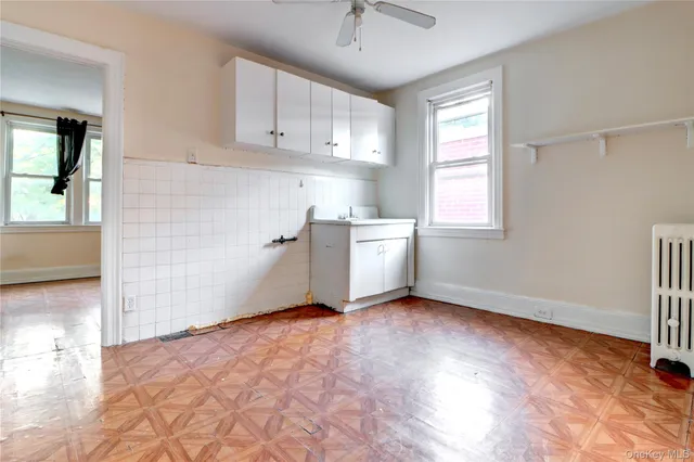 a view of an empty room with a fireplace
