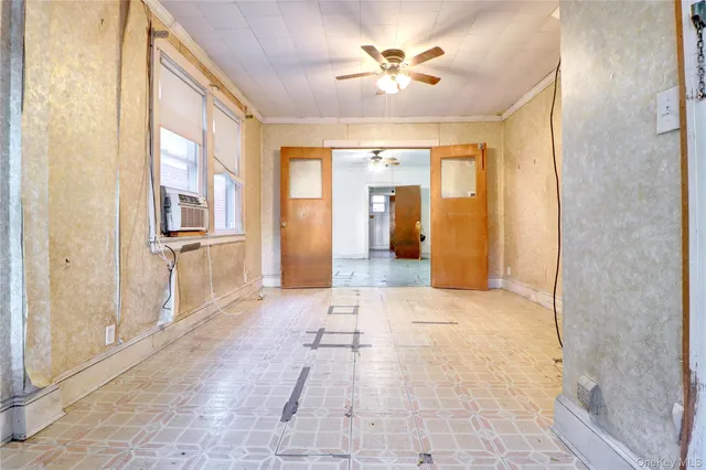 a view of a hallway with wooden shelves
