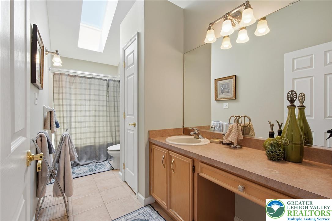 115 West Butternut Road Hellertown, PA 18055 - Photo 50 of 97 A skylight brightens this bath with a single vanity and ample counter space.