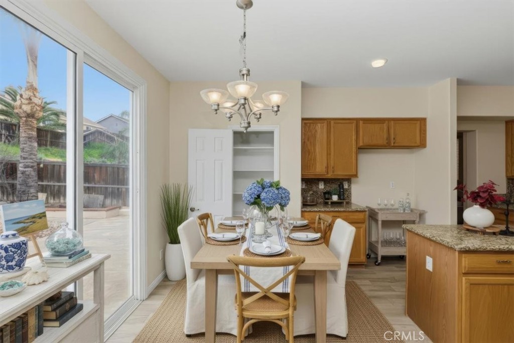 39264 Memory Drive Murrieta, CA 92563 - Photo 11 of 35 a view of a dining room with furniture and chandelier