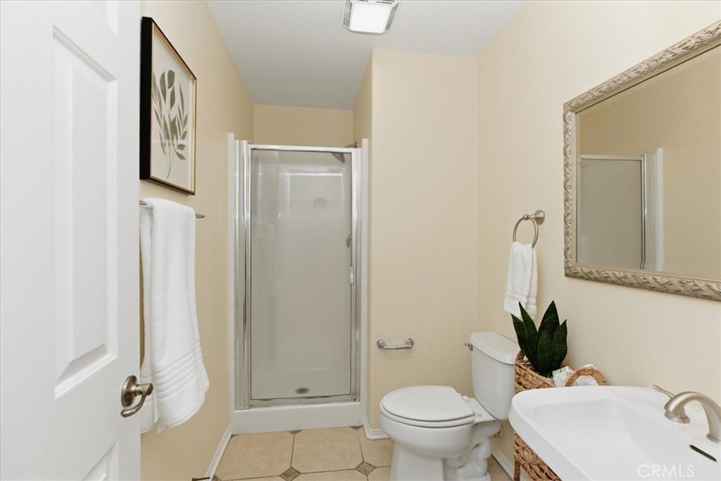 39264 Memory Drive Murrieta, CA 92563 - Photo 15 of 35 a bathroom with a toilet sink and shower