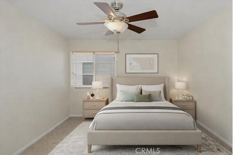 39264 Memory Drive Murrieta, CA 92563 - Photo 19 of 35 a bedroom with a large bed and a chandelier