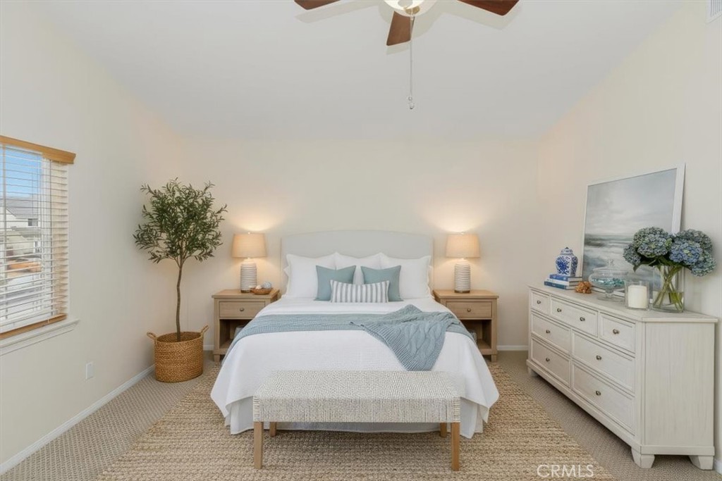 39264 Memory Drive Murrieta, CA 92563 - Photo 20 of 35 a bedroom with a bed and a potted plant