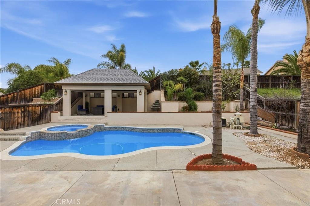 39264 Memory Drive Murrieta, CA 92563 - Photo 29 of 35 a front view of house with yard and swimming pool