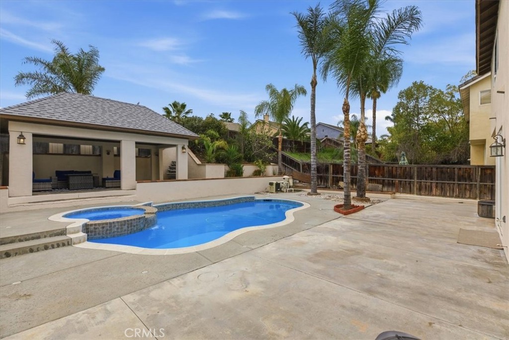 39264 Memory Drive Murrieta, CA 92563 - Photo 30 of 35 a view of a house with swimming pool and sitting area