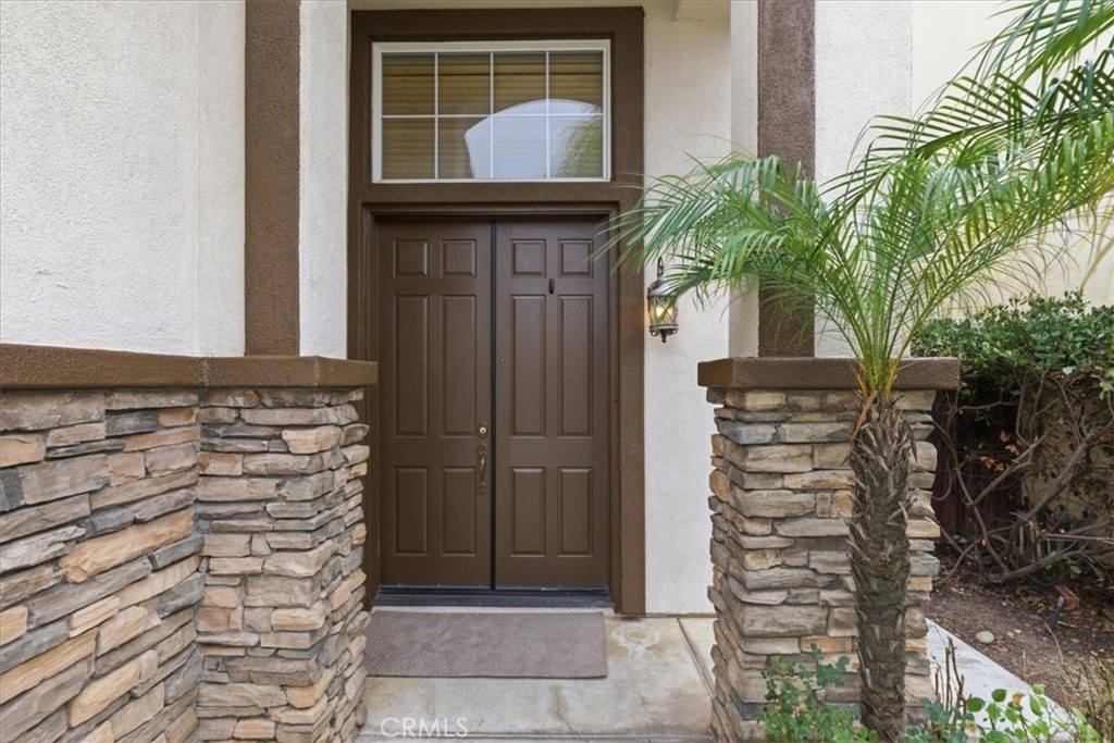 39264 Memory Drive Murrieta, CA 92563 - Photo 3 of 35 a front view of a house with a potted plant