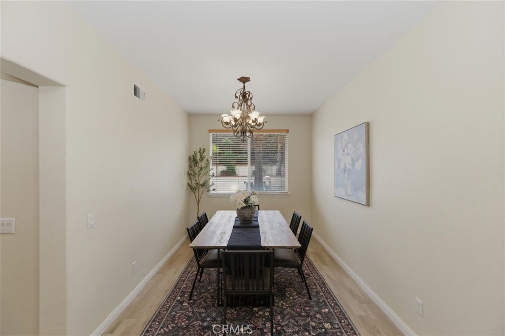 39264 Memory Drive Murrieta, CA 92563 - Photo 8 of 35 a room with painting on the wall and a table