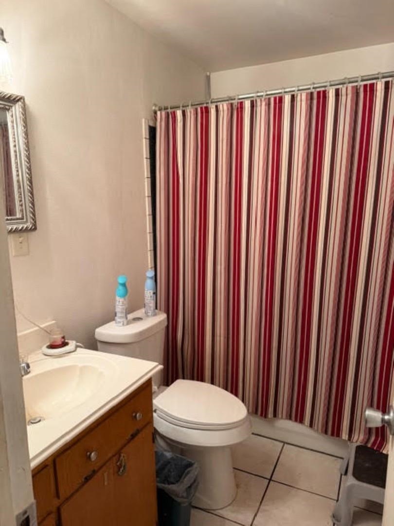 235 Connell Road Vidor, TX 77662 - Photo 18 of 35 a bathroom with a sink a toilet and shower curtain