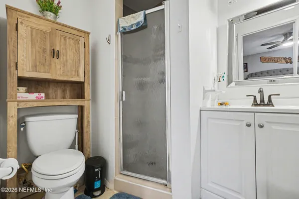 a bathroom with a toilet sink and shower