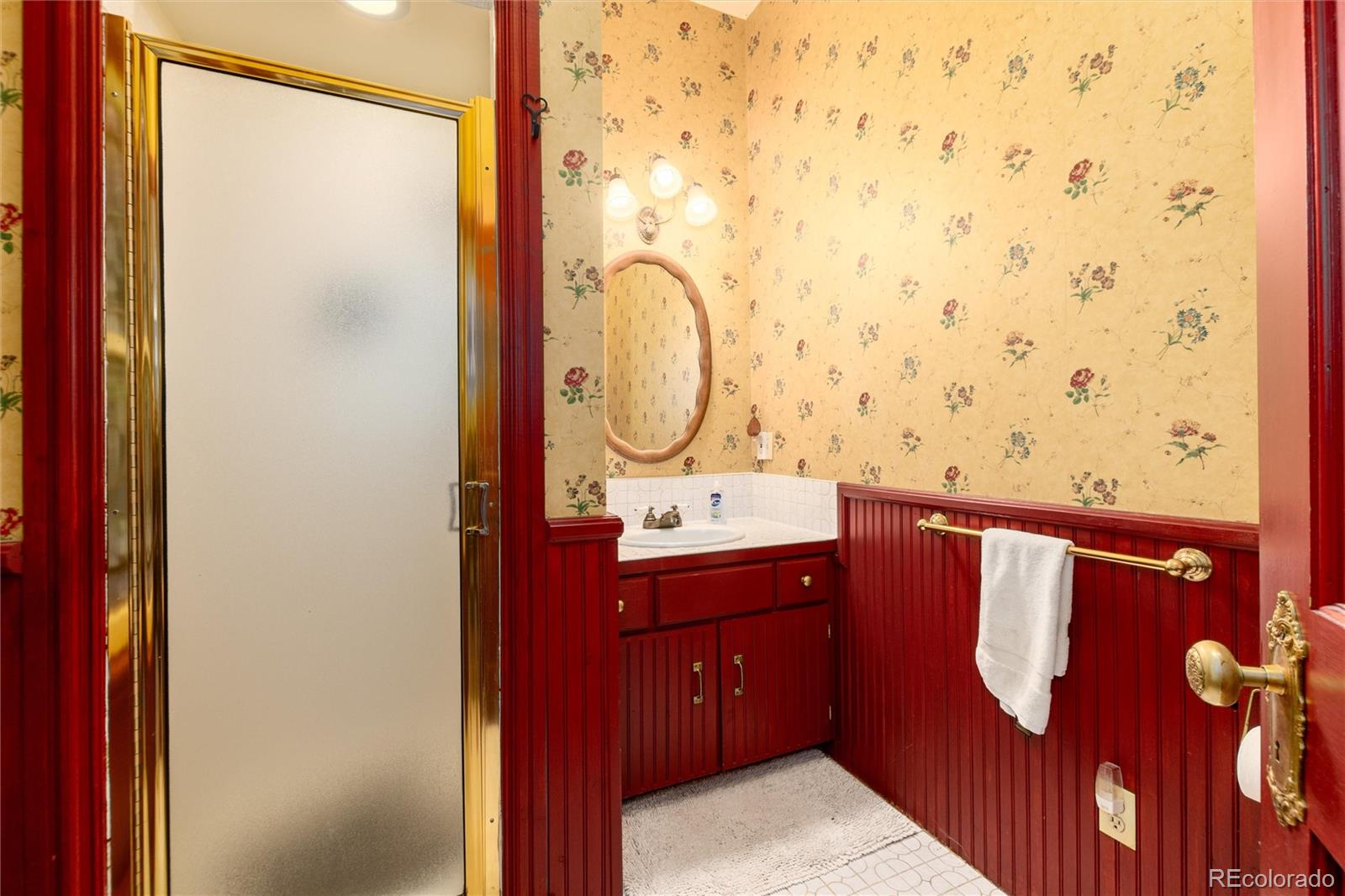 200 Rose Street Georgetown, CO 80444 - Photo 14 of 43 a bathroom with a sink a mirror and a shower