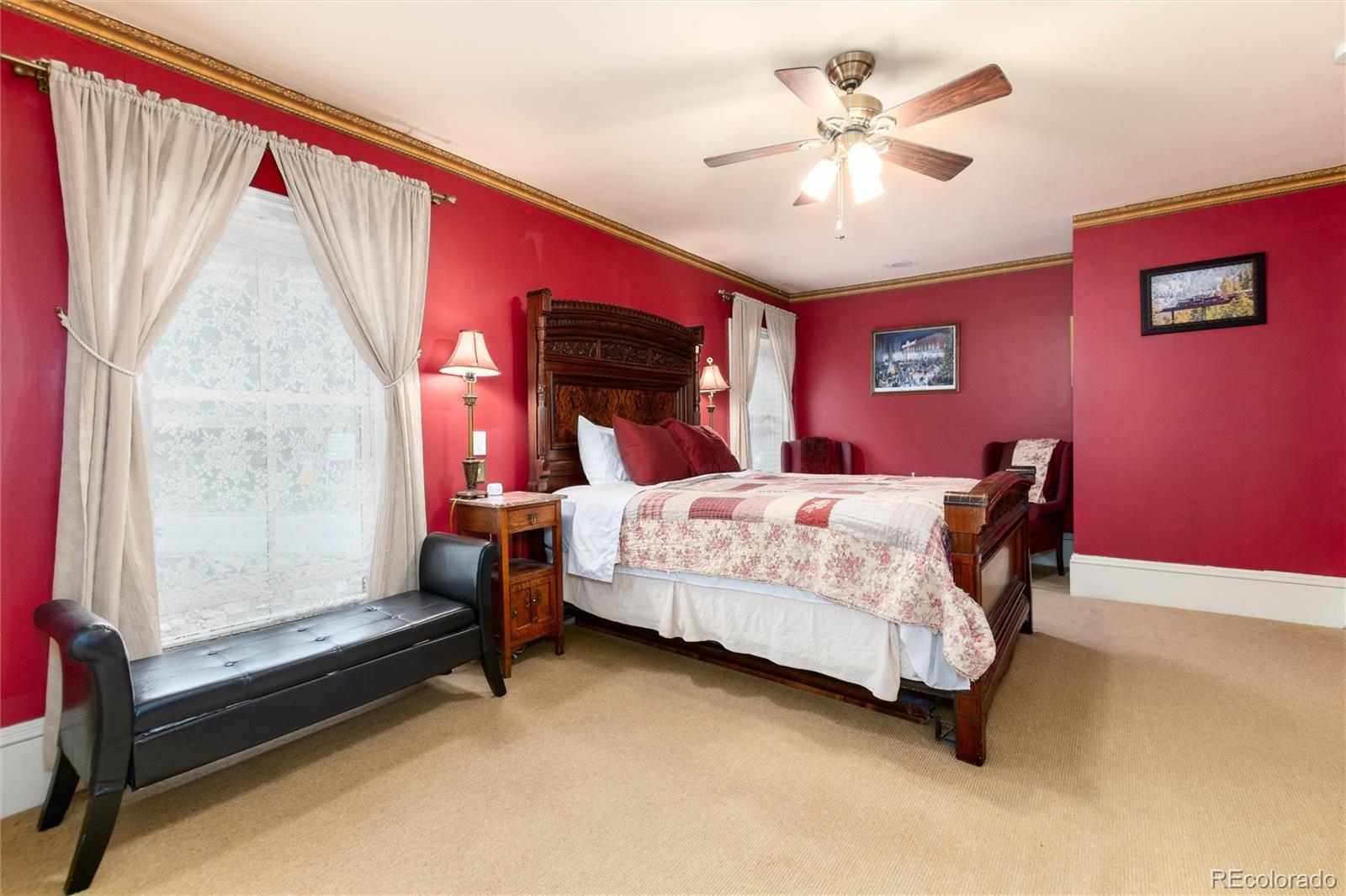 200 Rose Street Georgetown, CO 80444 - Photo 16 of 43 a bedroom with a bed and a chandelier